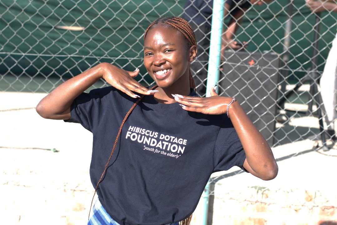 Young volunteer smiling during elder visit