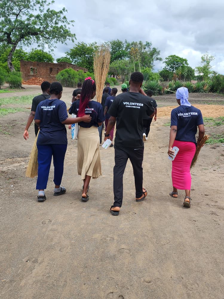 Youth volunteers conversing with elders